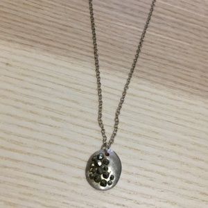 simple silver necklace with small circle